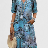 Vestido Perla Boho con Estampado Floral y Detalles de Crochet